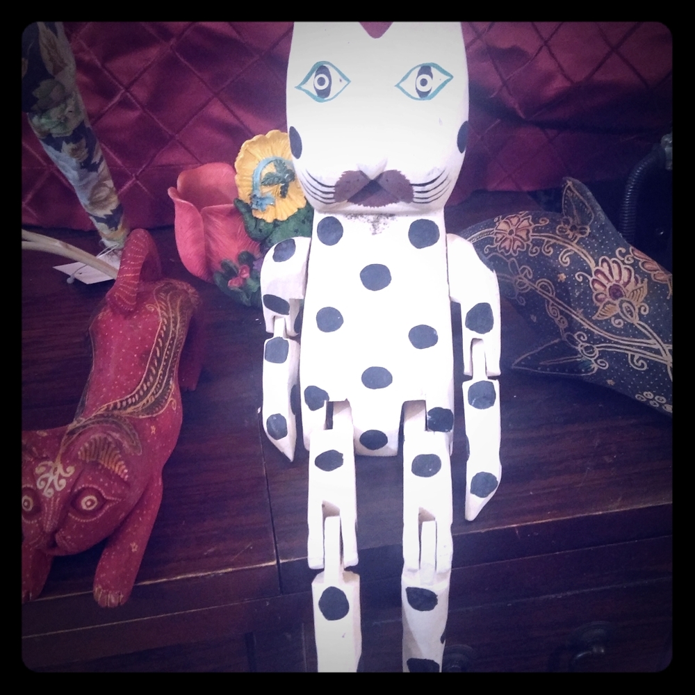 Vintage wooden statues with movable arms and legs.